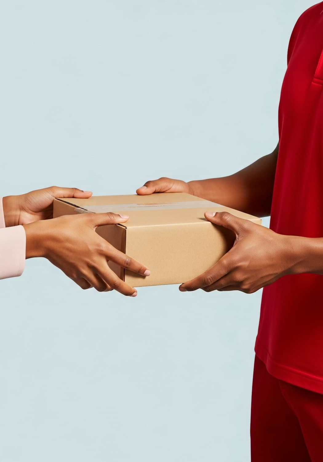 A parcel being handed from one person to another